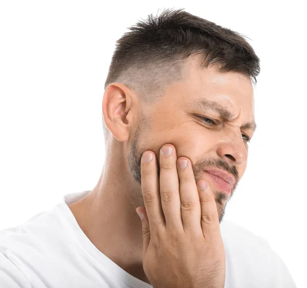 Man som lider av tandvärk mot vit bakgrund — Stockfoto