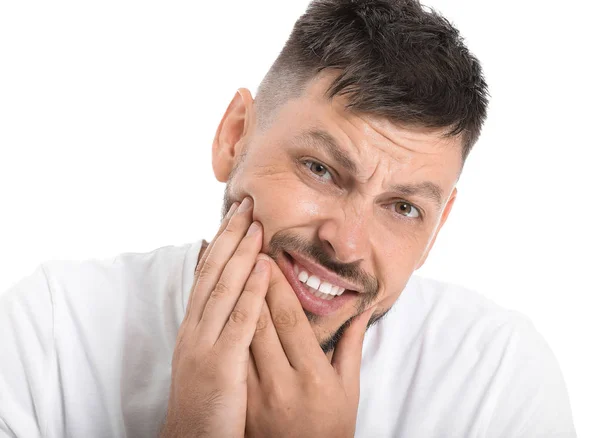 Man suffering from toothache against white background — Stock Photo, Image