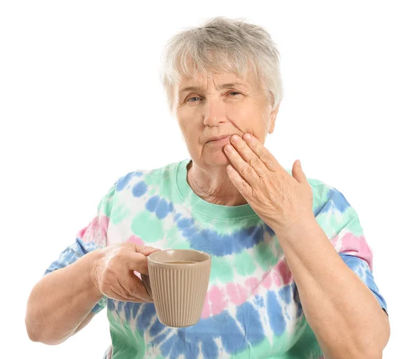 Senior woman suffering from toothache against white background — Stock Photo, Image