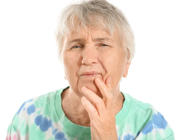 Senior woman suffering from toothache against white background — Stock Photo, Image