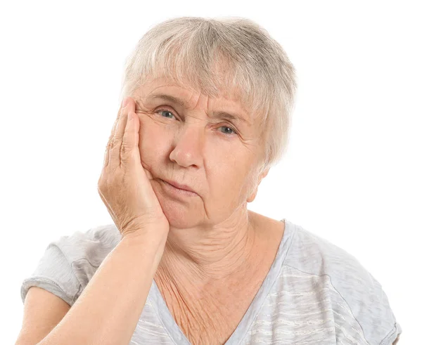 Senior woman suffering from toothache against white background — Stock Photo, Image