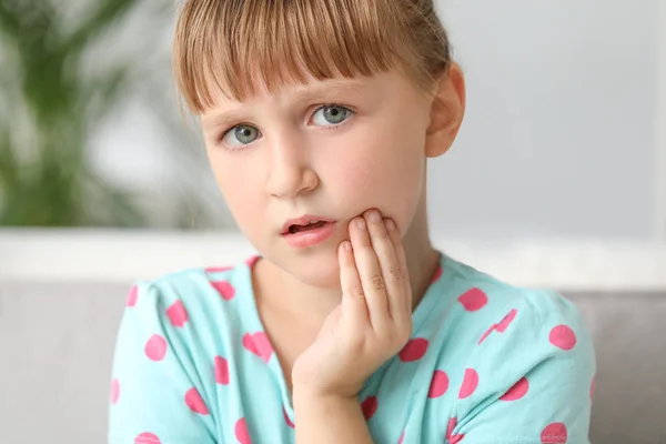 Little girl suffering from toothache at home — Stock Photo, Image