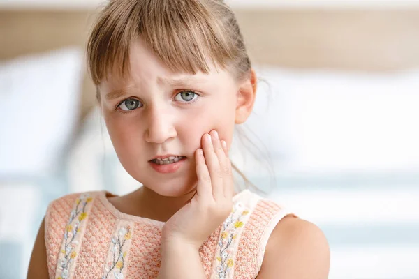 Little girl suffering from toothache at home — Stock Photo, Image