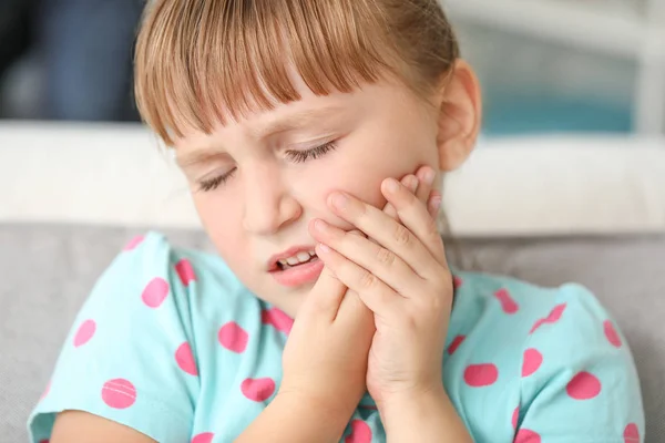 Little girl suffering from toothache at home — Stock Photo, Image