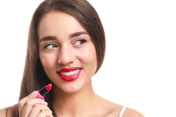 Beautiful young woman with lipstick on white background — Stock Photo, Image