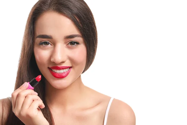 Beautiful young woman with lipstick on white background — Stock Photo, Image