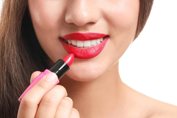 Beautiful young woman with lipstick on white background, closeup — Stock Photo, Image