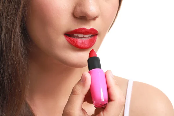 Beautiful young woman with lipstick on white background, closeup — Stock Photo, Image