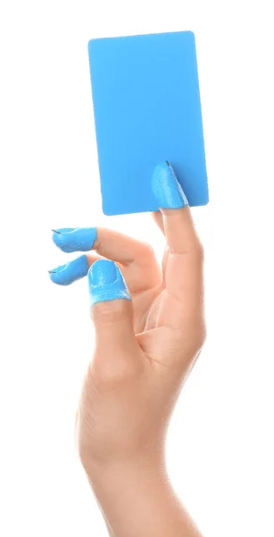 Painted female hand with card on white background — Stock Photo, Image