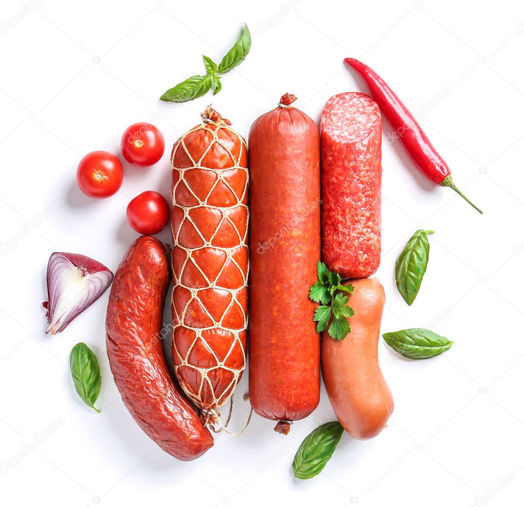 Assortment of sausages on white background