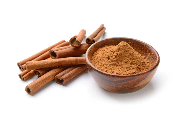 Aromatic cinnamon sticks and powder on white background — Stock Photo, Image