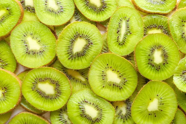 Slices of ripe kiwi as background — Stock Photo, Image
