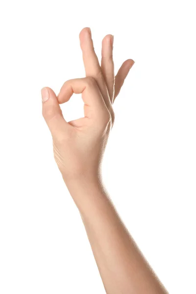 Női kéz mutatja OK gesztus fehér háttér — Stock Fotó
