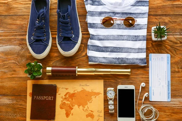 Set of items for travel on wooden background — Stock Photo, Image