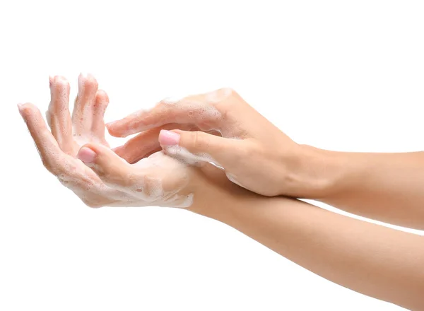 Mains féminines avec savon sur fond blanc — Photo