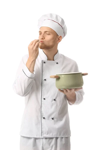 Bonito chef masculino com sopa no fundo branco — Fotografia de Stock