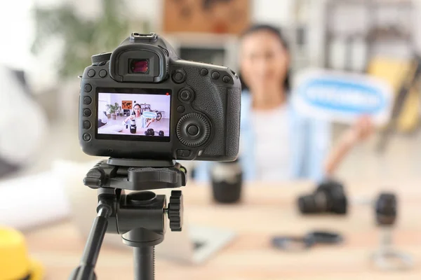 Female Asian blogger announcing giveaway while recording video at home — Stock Photo, Image