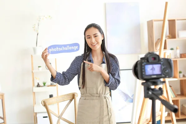 Female Asian blogger recording video in workshop — Stock Photo, Image