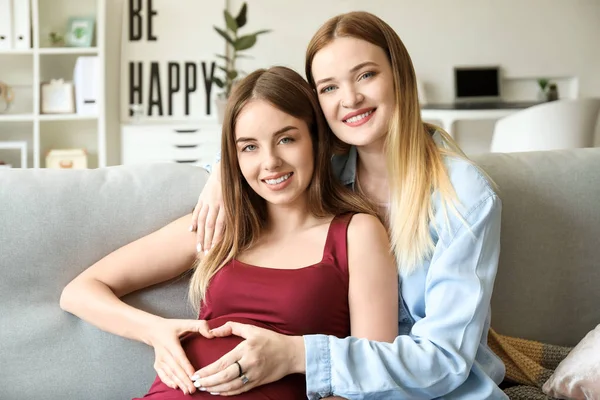 Happy pregnant lesbian couple at home — Stock Photo, Image