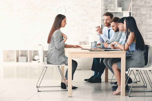 Human resources commission interviewing woman in office