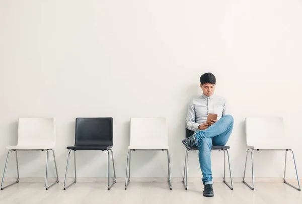 Asian man waiting for job interview indoors — Stock Photo, Image