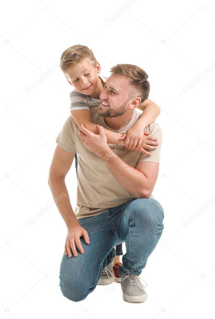 Portrait of happy father and son on white background