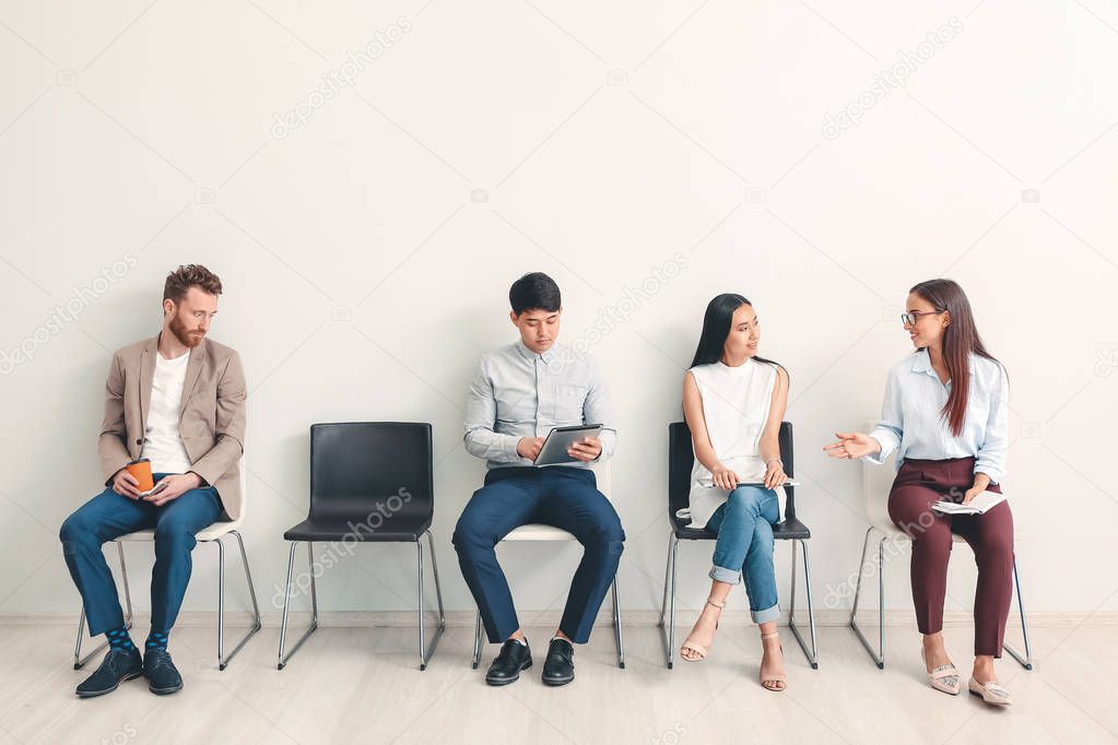 Young people waiting for job interview indoors
