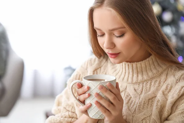 Beautiful woman drinking hot chocolate at home — Stock Photo, Image