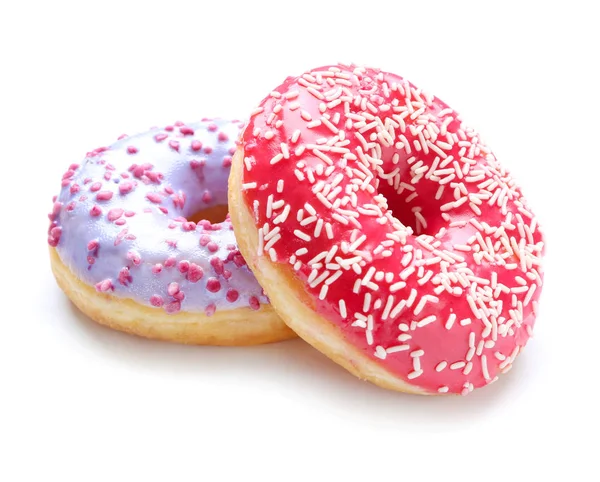 Süße leckere Donuts auf weißem Hintergrund — Stockfoto