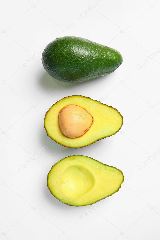 Ripe avocados on white background