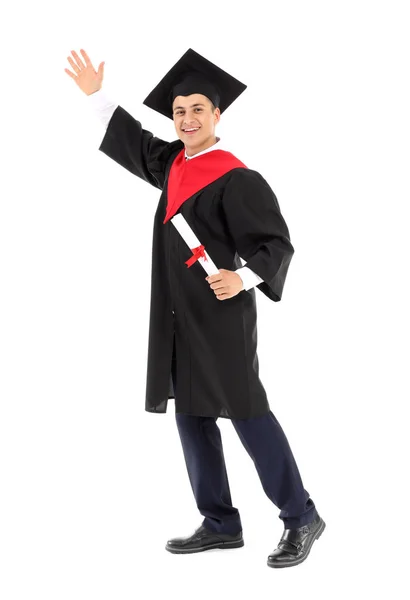 Young male student in bachelor robe and with diploma on white background — Stock Photo, Image