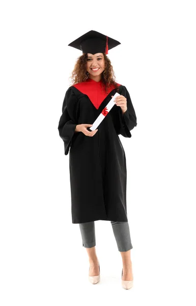 Young African-American student in bachelor robe and with diploma on white background — Stock Photo, Image