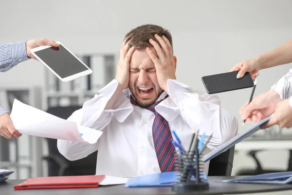 Overworked businessman having panic attack in office — Stock Photo, Image