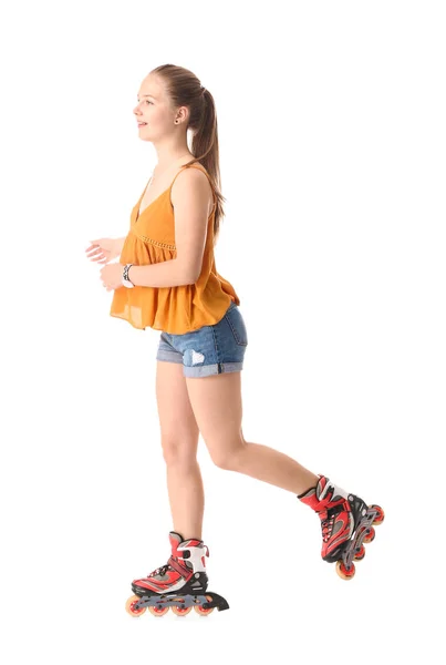 Adolescente chica en patines sobre fondo blanco —  Fotos de Stock