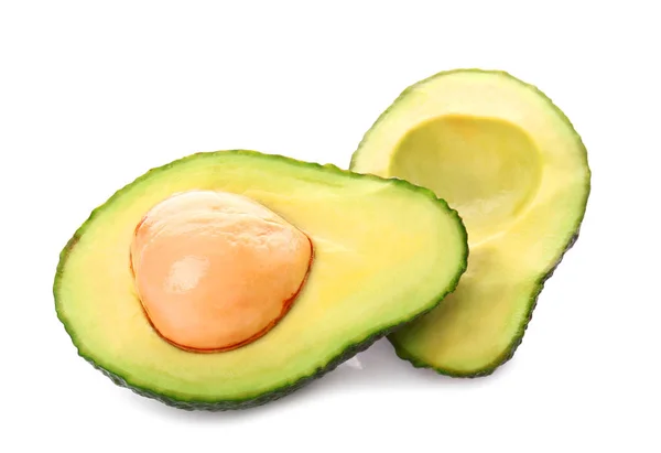 Halves of ripe avocado on white background — Stock Photo, Image