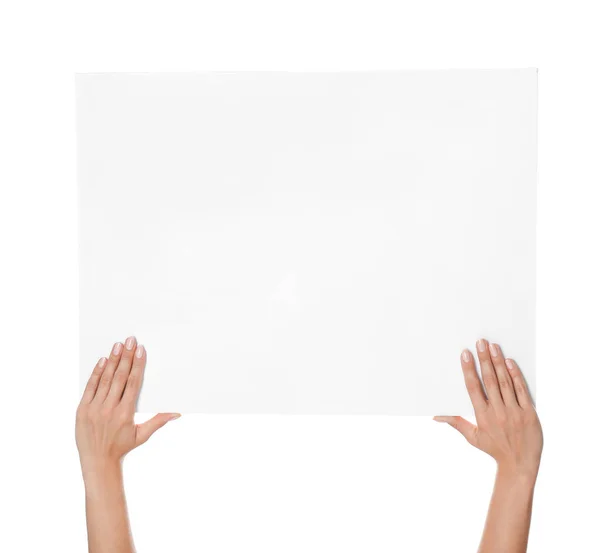 Női kezek üres poszterrel fehér alapon — Stock Fotó