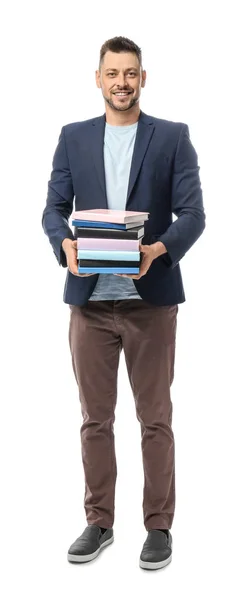 Schöner männlicher Lehrer mit Büchern auf weißem Hintergrund — Stockfoto