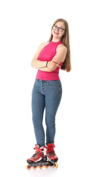 Tiener meisje op rolschaatsen tegen witte achtergrond — Stockfoto