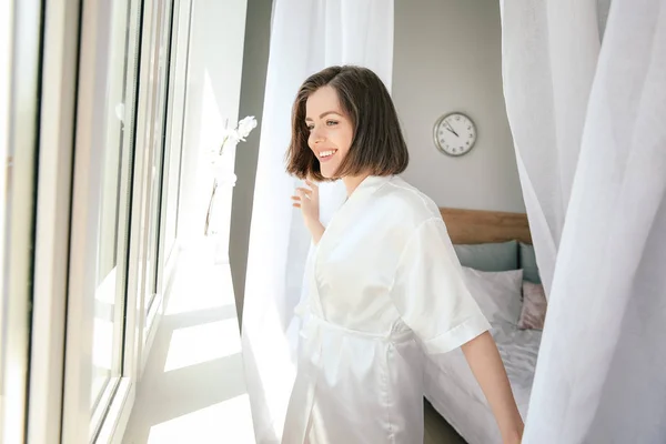 Morning of beautiful young woman near window — Stock Photo, Image