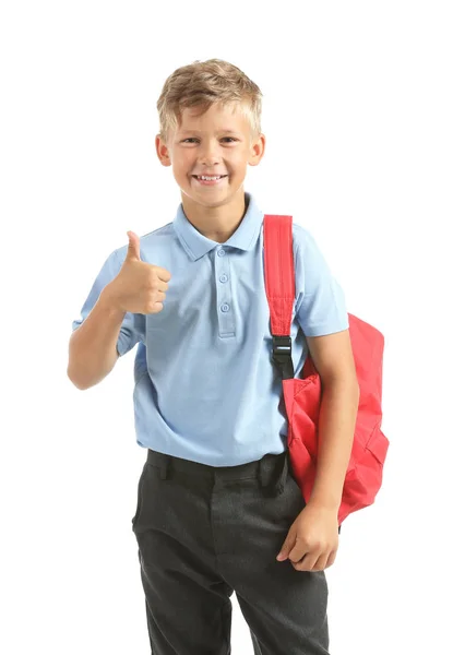 Pequeño colegial mostrando el pulgar hacia arriba sobre fondo blanco — Foto de Stock