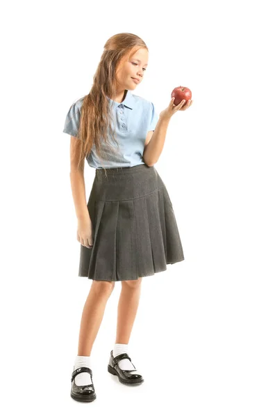 Pequeña colegiala con manzana sobre fondo blanco — Foto de Stock