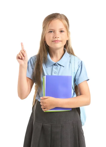 Mała uczennica z podniesioną palcem wskazującym na białym tle — Zdjęcie stockowe
