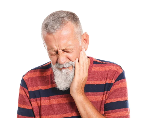 Senior man suffering from toothache against white background — Stock Photo, Image
