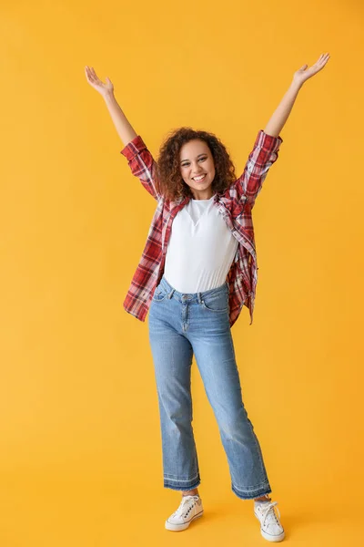 Happy African-American woman on color background — Stock Photo, Image