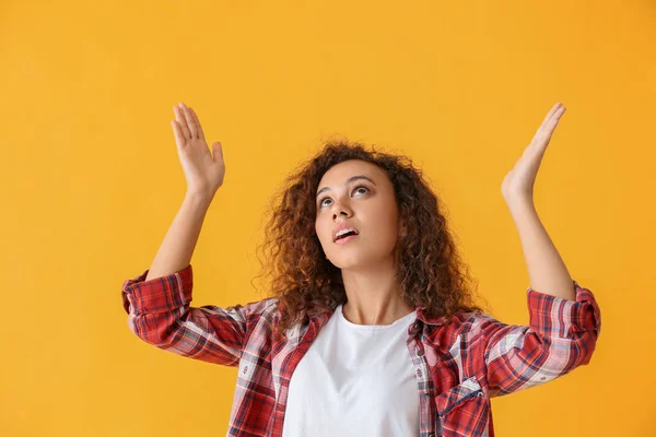 Beautiful African-American woman on color background — Stock Photo, Image