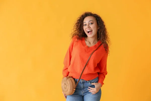Happy African-American woman on color background — Stock Photo, Image