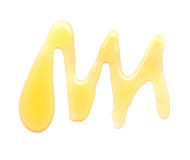 Beyaz arka planda bal döküldü