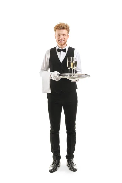 Schöner Kellner mit Tablett mit Champagner auf weißem Hintergrund — Stockfoto