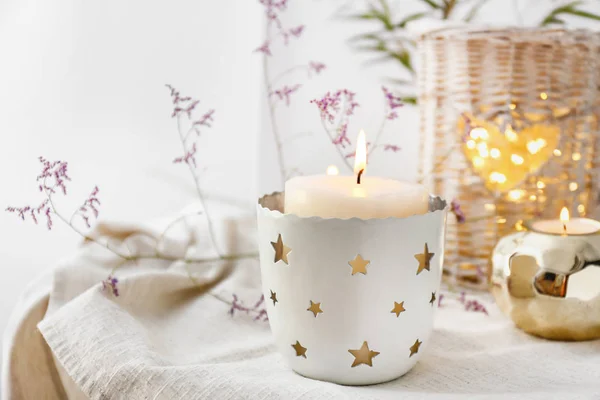 Composition with beautiful burning candles and flowers on table — Stock Photo, Image