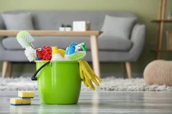 Set of cleaning supplies in room — Stock Photo, Image